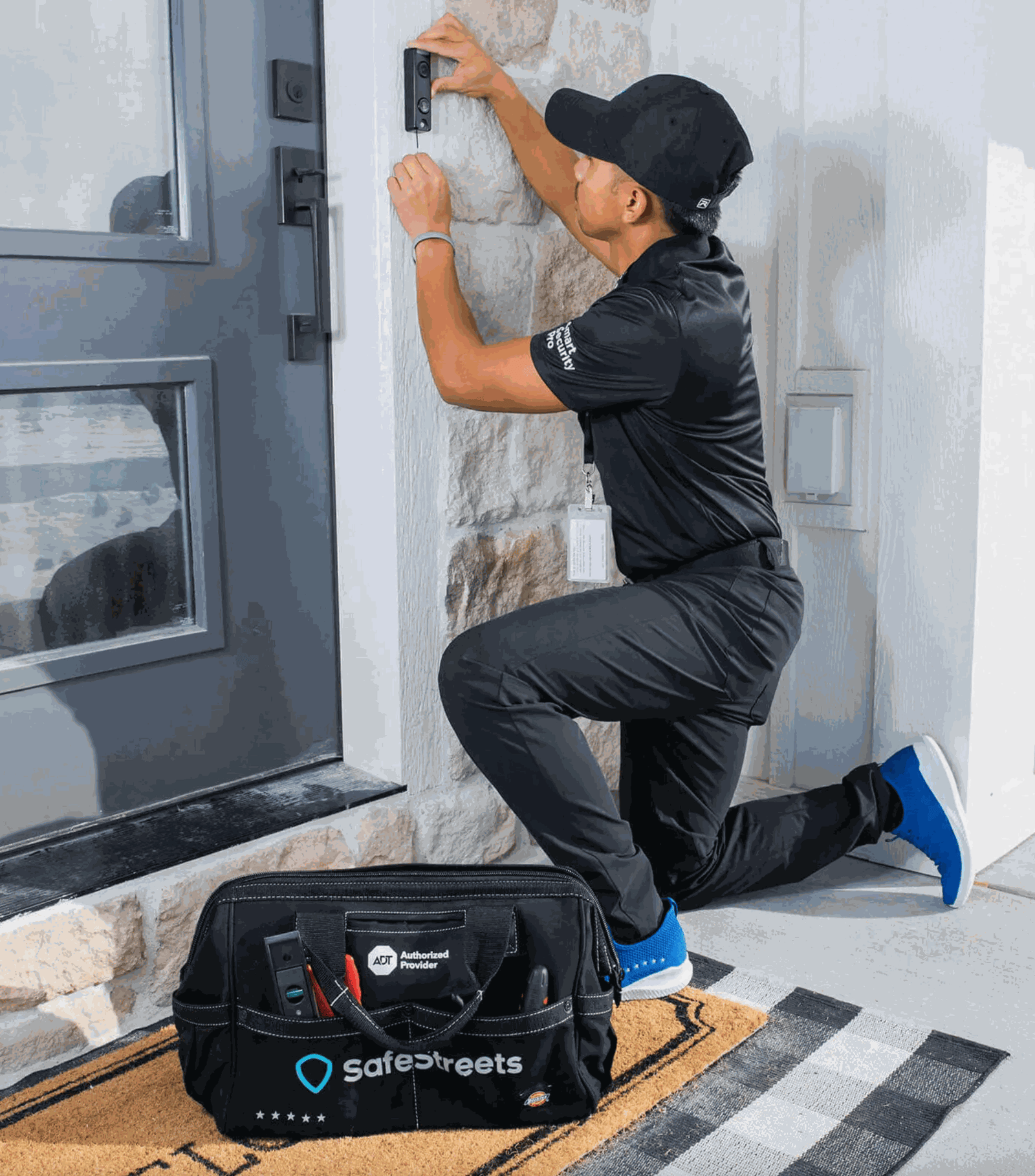 SafeStreets professional technician installing an ADT doorbell camera